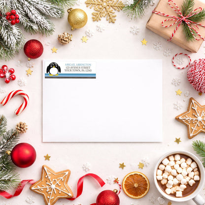 Cute Penguin Blue Rustic Address Label shown on a white envelope with winter Christmas holiday supplies
