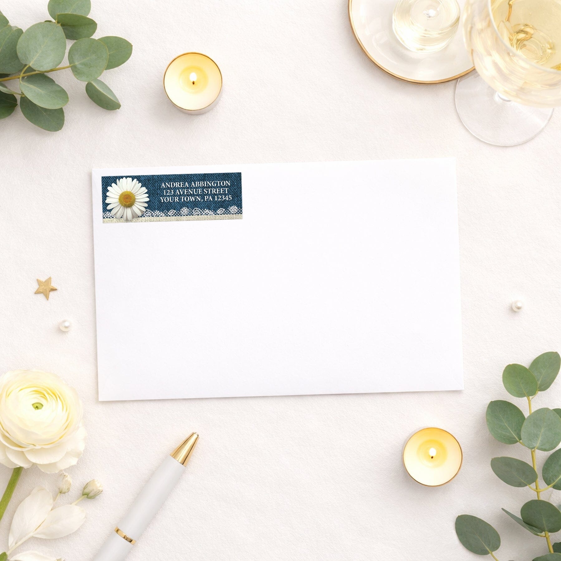 Daisy Burlap and Lace Denim Address Label shown on a white envelope with wedding and shower supplies