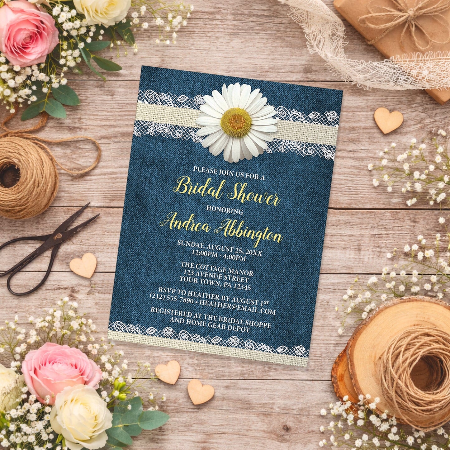 Daisy Burlap and Lace Denim Bridal Shower Invitation shown on a country wooden surface with spring and summer flowers, small wood hearts, lace ribbon, and twine.