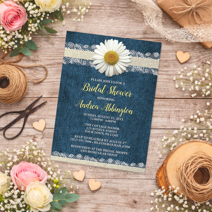Daisy Burlap and Lace Denim Bridal Shower Invitation shown on a country wooden surface with spring and summer flowers, small wood hearts, lace ribbon, and twine.