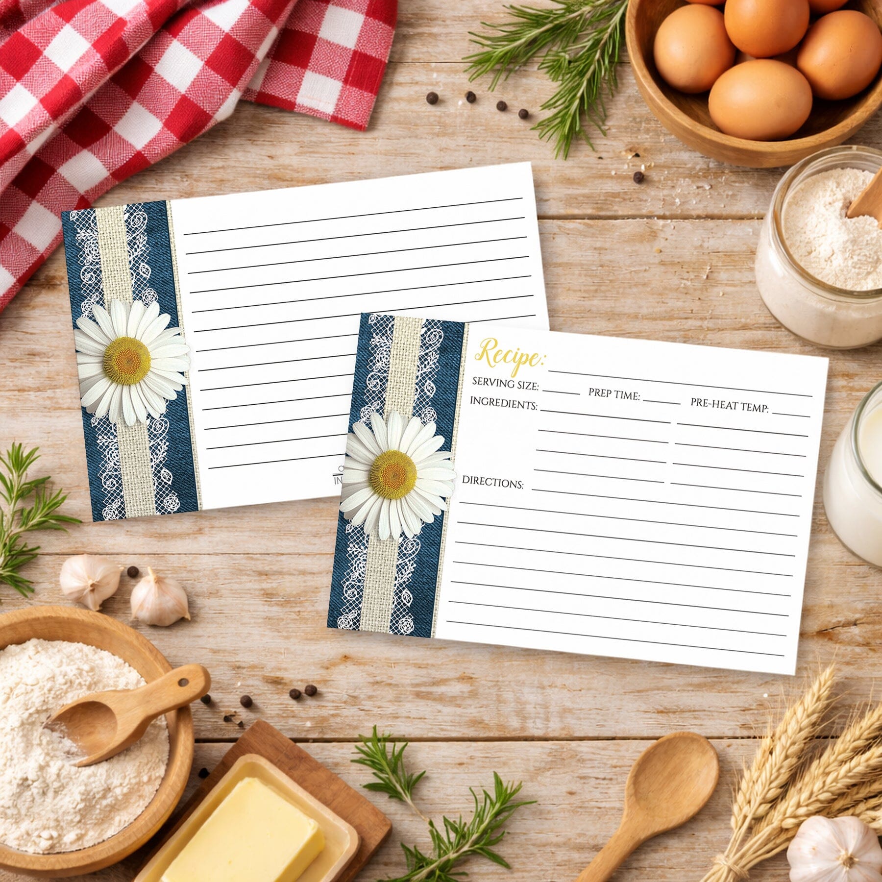 Two Daisy Burlap and Lace Denim Recipe Cards on a country wooden table with cooking ingredients.