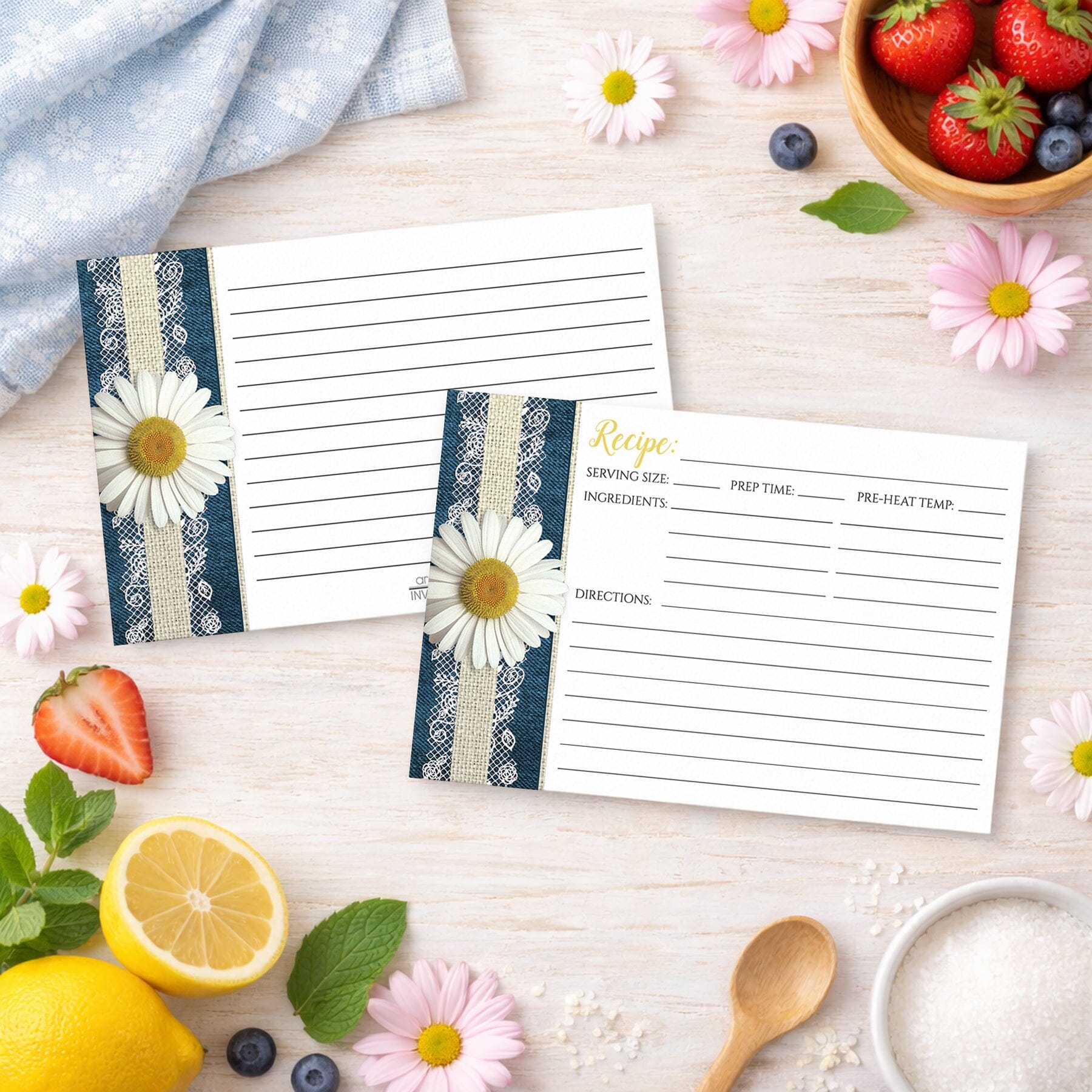 Two Daisy Burlap and Lace Denim Recipe Cards on a wooden surface with spring and summer fruits and flowers.