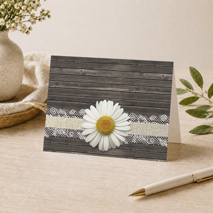 Daisy Burlap and Lace Wood Note Card shown on a desk with a vase, plants, and a pen.