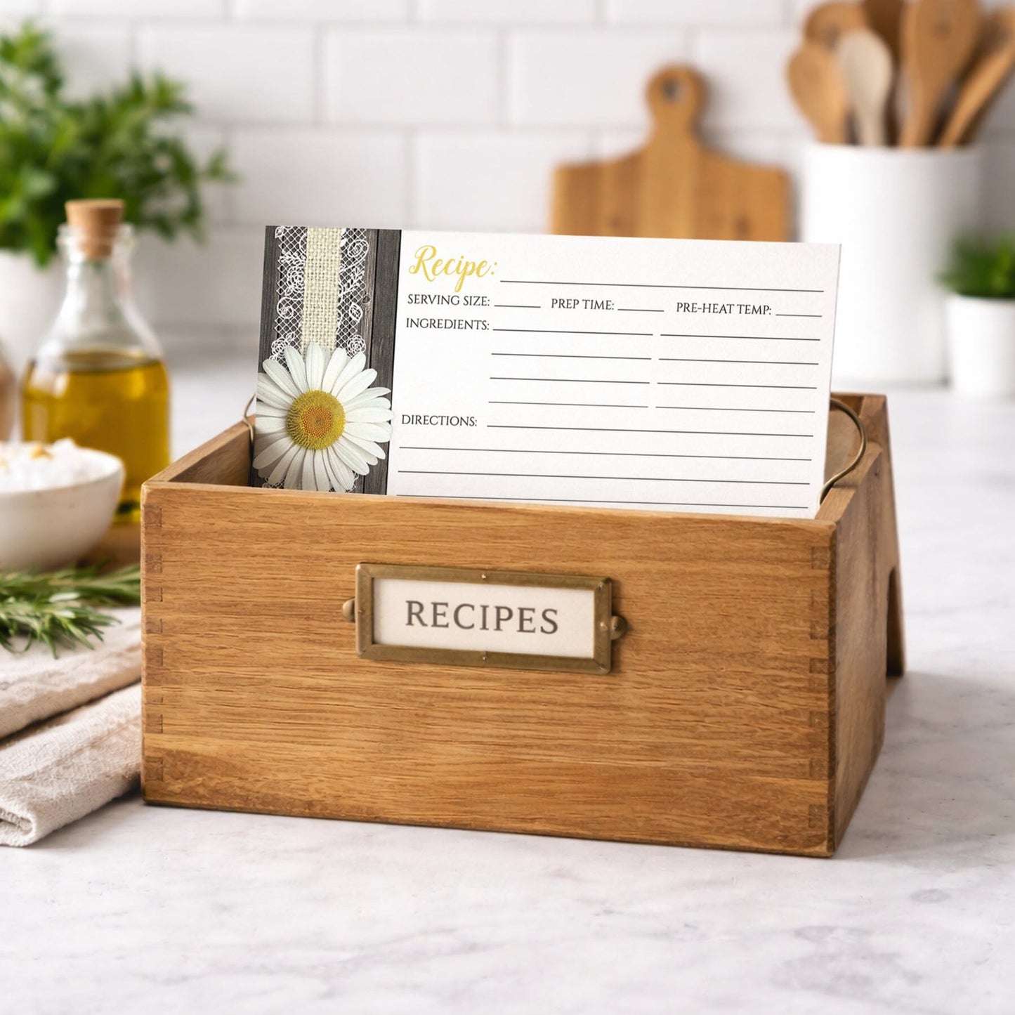 Wooden recipe box with a Daisy Burlap and Lace Wood Recipe Card on top in a kitchen setting