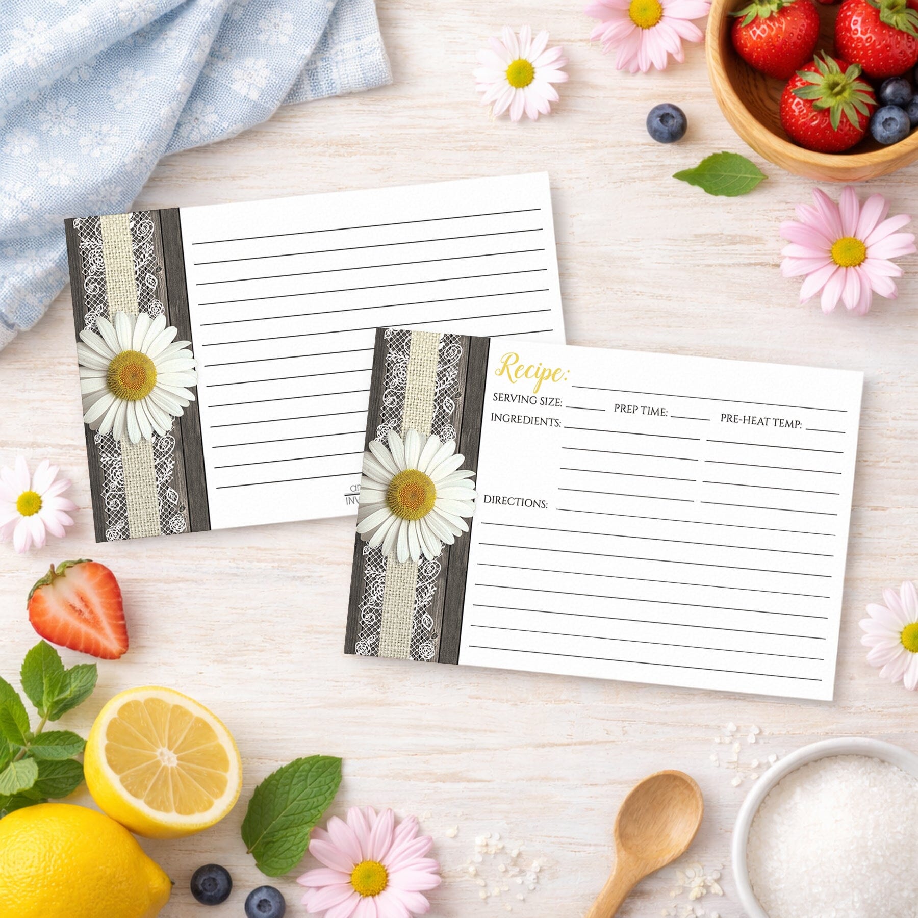 Two Daisy Burlap and Lace Wood Recipe Cards on a wooden surface with fruits and flowers.