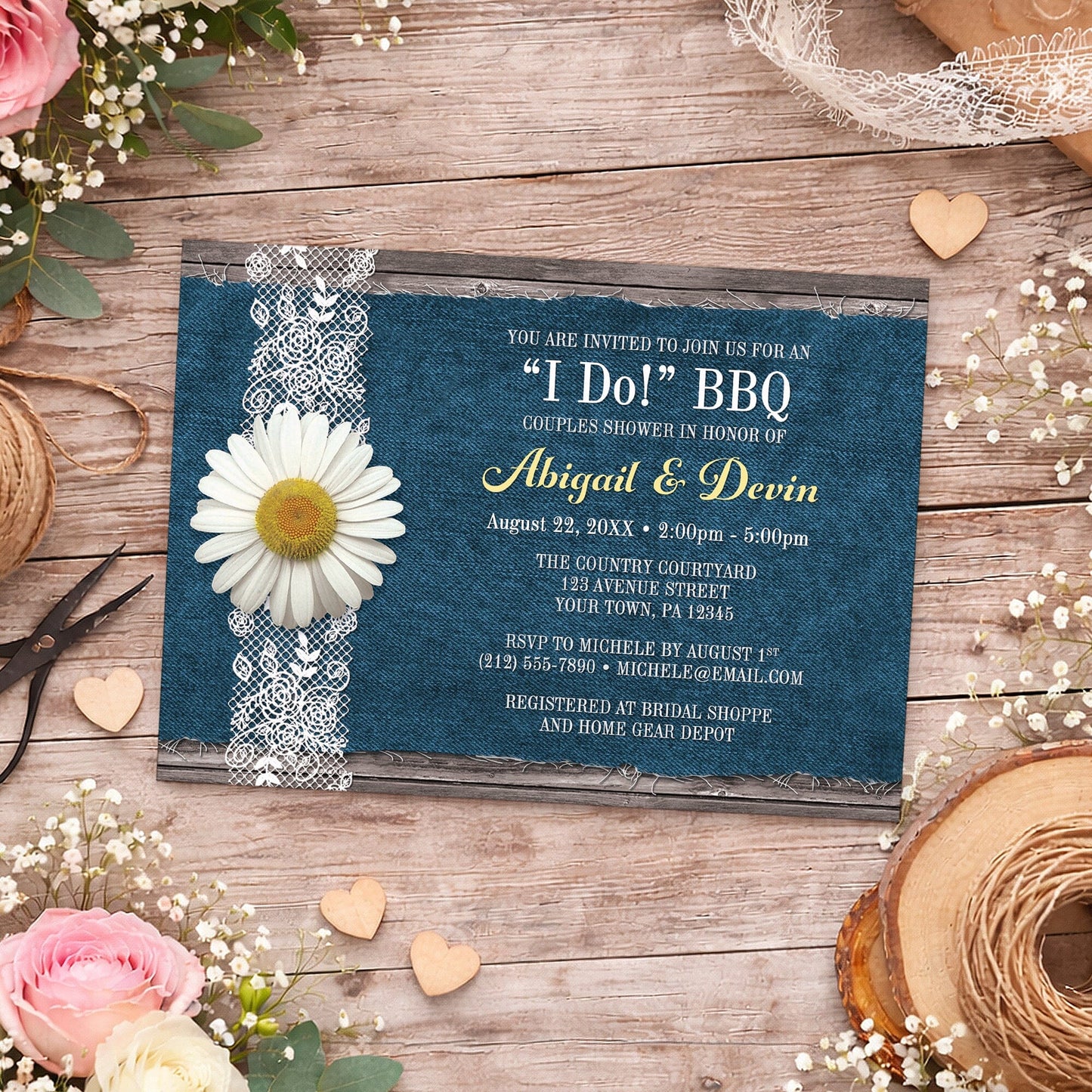 Daisy Denim and Lace I Do BBQ Couples Shower Invitation shown on a wooden surface with spring and summer flowers, small wood hearts, lace, and twine.
