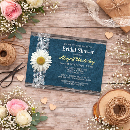 Daisy Denim and Lace Rustic Bridal Shower Invitation shown on a country wooden surface with spring and summer flowers, small wood hearts, ribbon, and twine.