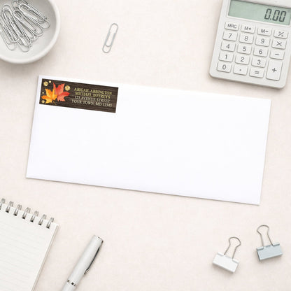 Falling Leaves with Gold Autumn Address Label shown on a white envelope with office supplies