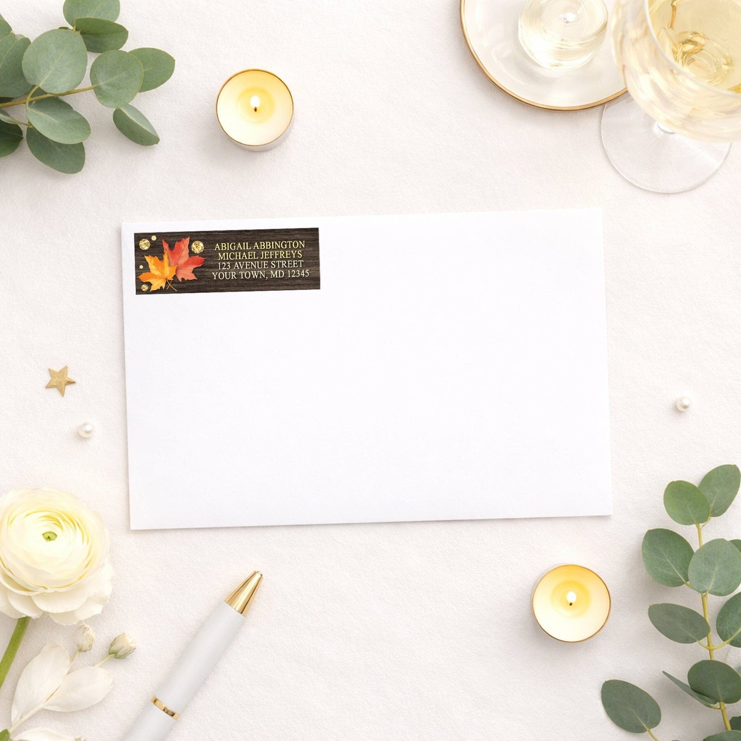 Falling Leaves with Gold Autumn Address Label shown on a white envelope with wedding or shower supplies