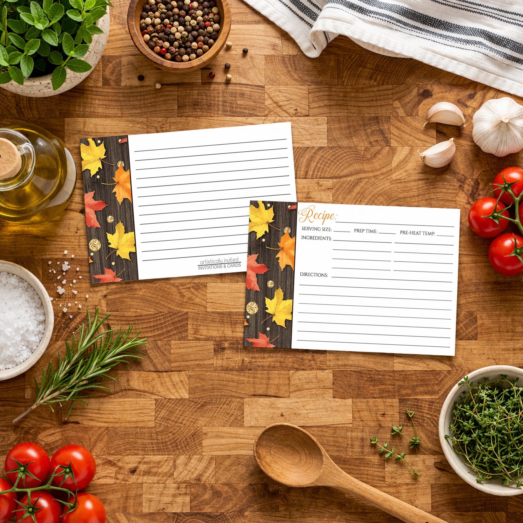 Two Falling Leaves with Gold Autumn Recipe Cards on a wooden surface with Italian kitchen items around