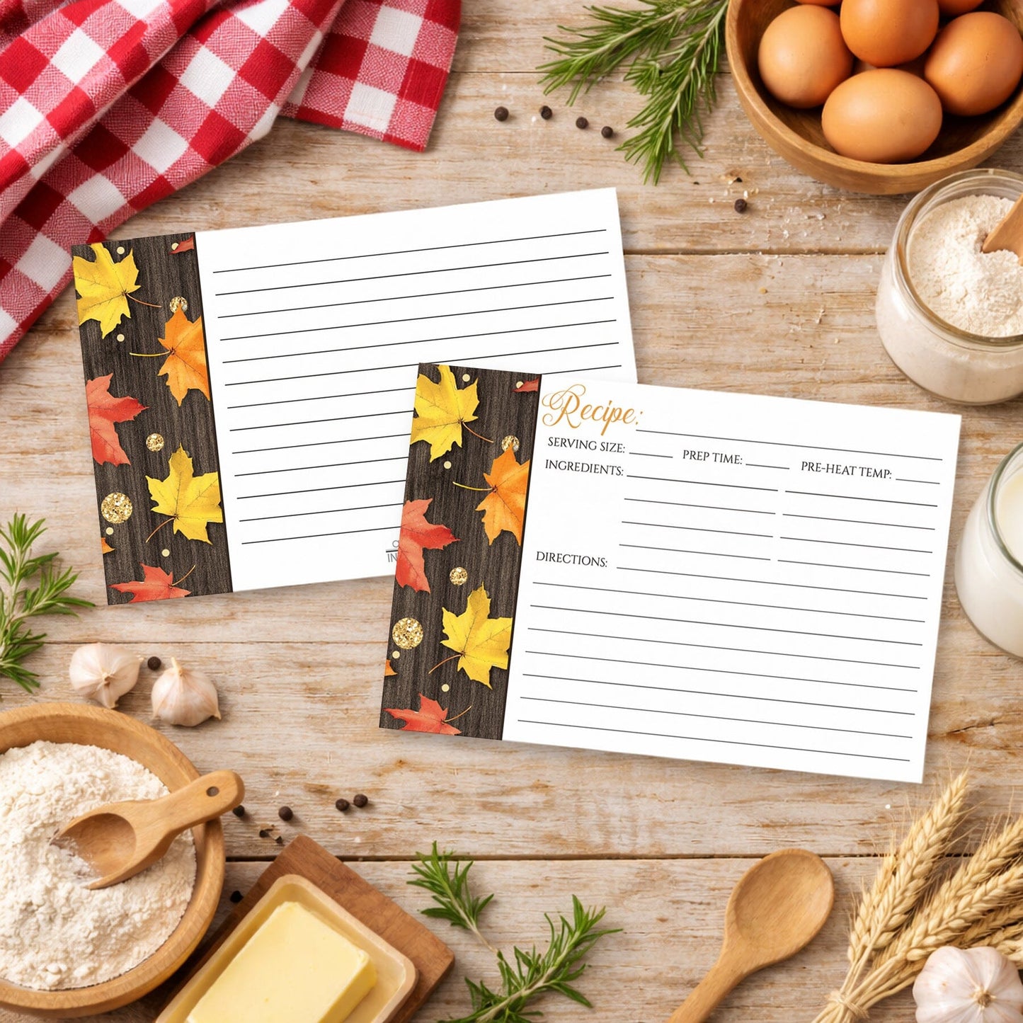 Set of Falling Leaves with Gold Autumn Recipe Cards on a wooden table in a country kitchen with cooking ingredients.