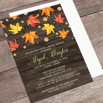 Autumn-themed bridal shower invitation with leaves on a wooden background