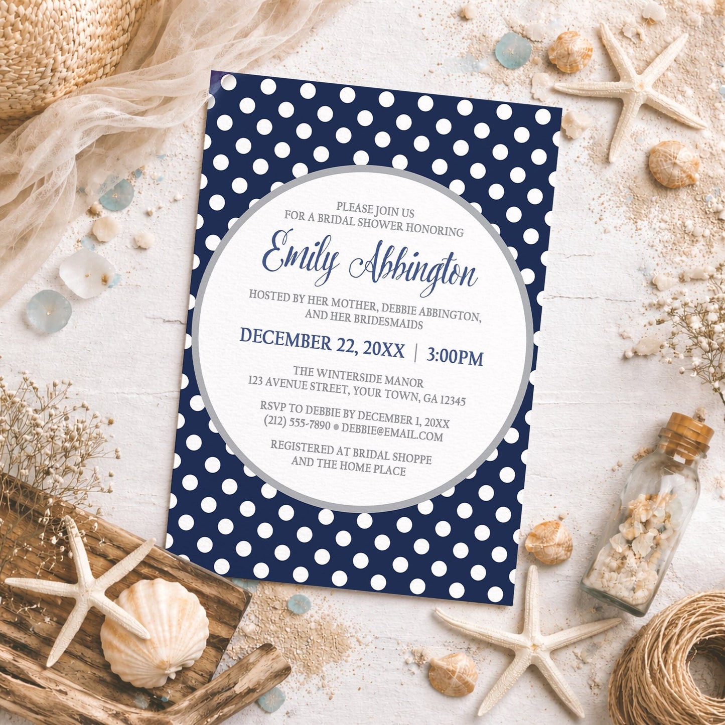 Gray Navy Blue Polka Dot Bridal Shower Invitation on a rough surface with beach-themed and nautical decorations