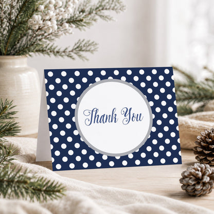Gray Navy Blue Polka Dot Thank You Card shown on a tabletop with a vase, winter greenery, and pine cones.