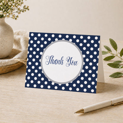 Gray Navy Blue Polka Dot Thank You Card shown on a desk with a vase, plants, and a pen.