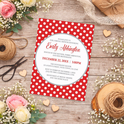 Gray and Red Polka Dot Bridal Shower Invitation shown on a country-inspired wooden surface with spring and summer flowers, small wood hearts, lace ribbon, and twine.