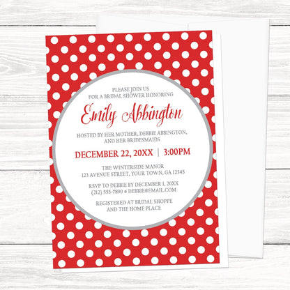 Gray and Red Polka Dot Bridal Shower Invitation on a light wood surface with a white envelope.