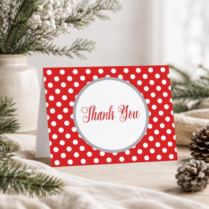 Gray and Red Polka Dot Thank You Card shown on a tabletop with a vase, winter greenery, and pine cones.