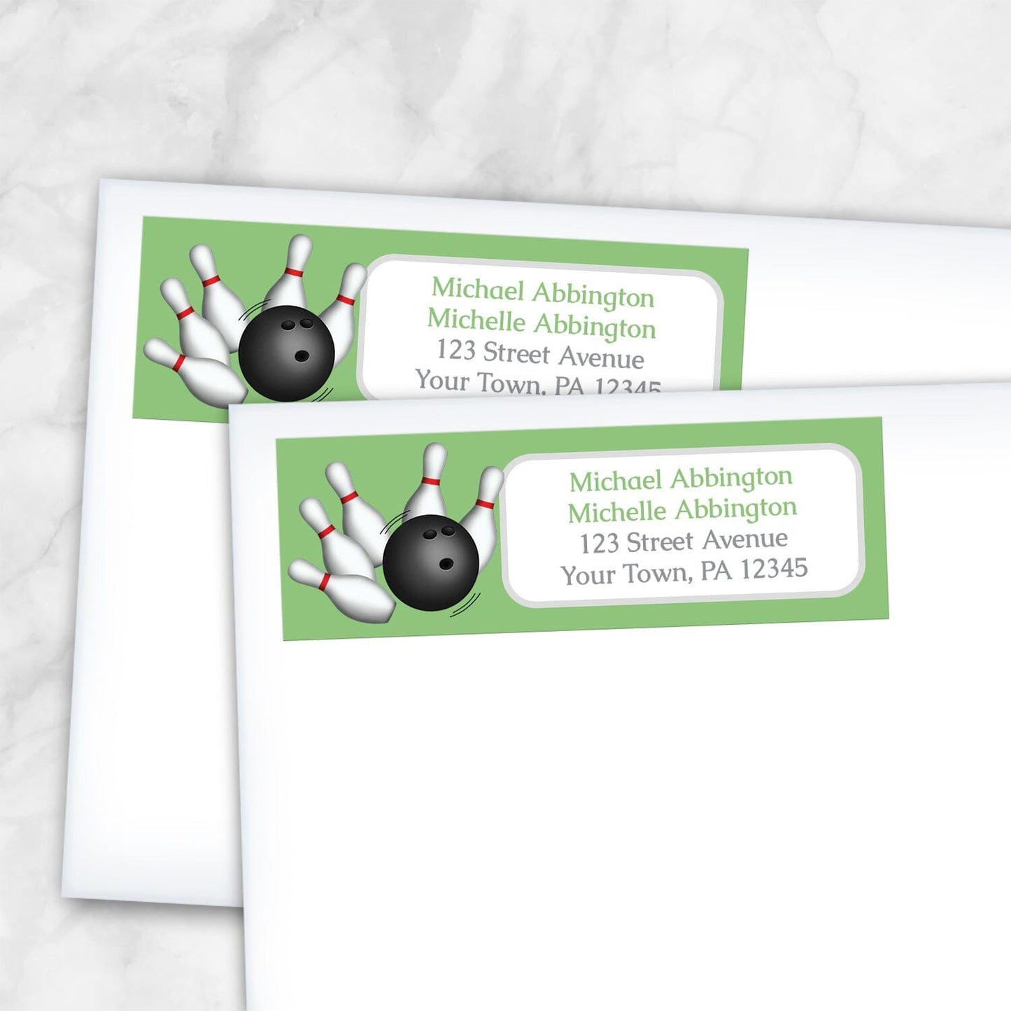 2 Green Bowling Return Address Labels shown on white envelopes on a marble surface