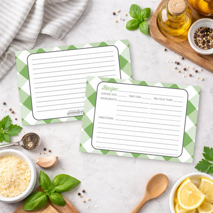 Two Green Gingham Recipe Cards with green checkered borders on a kitchen counter with ingredients.