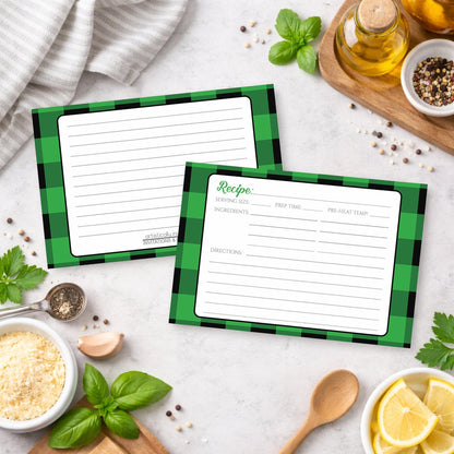 Two Green and Black Buffalo Plaid Recipe Cards with green checkered borders on a kitchen counter with ingredients.