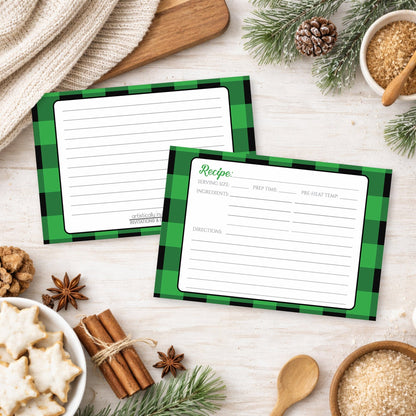 Two Green and Black Buffalo Plaid Recipe Cards on a festive background with holiday cookies, cinnamon, and winter pine cones.