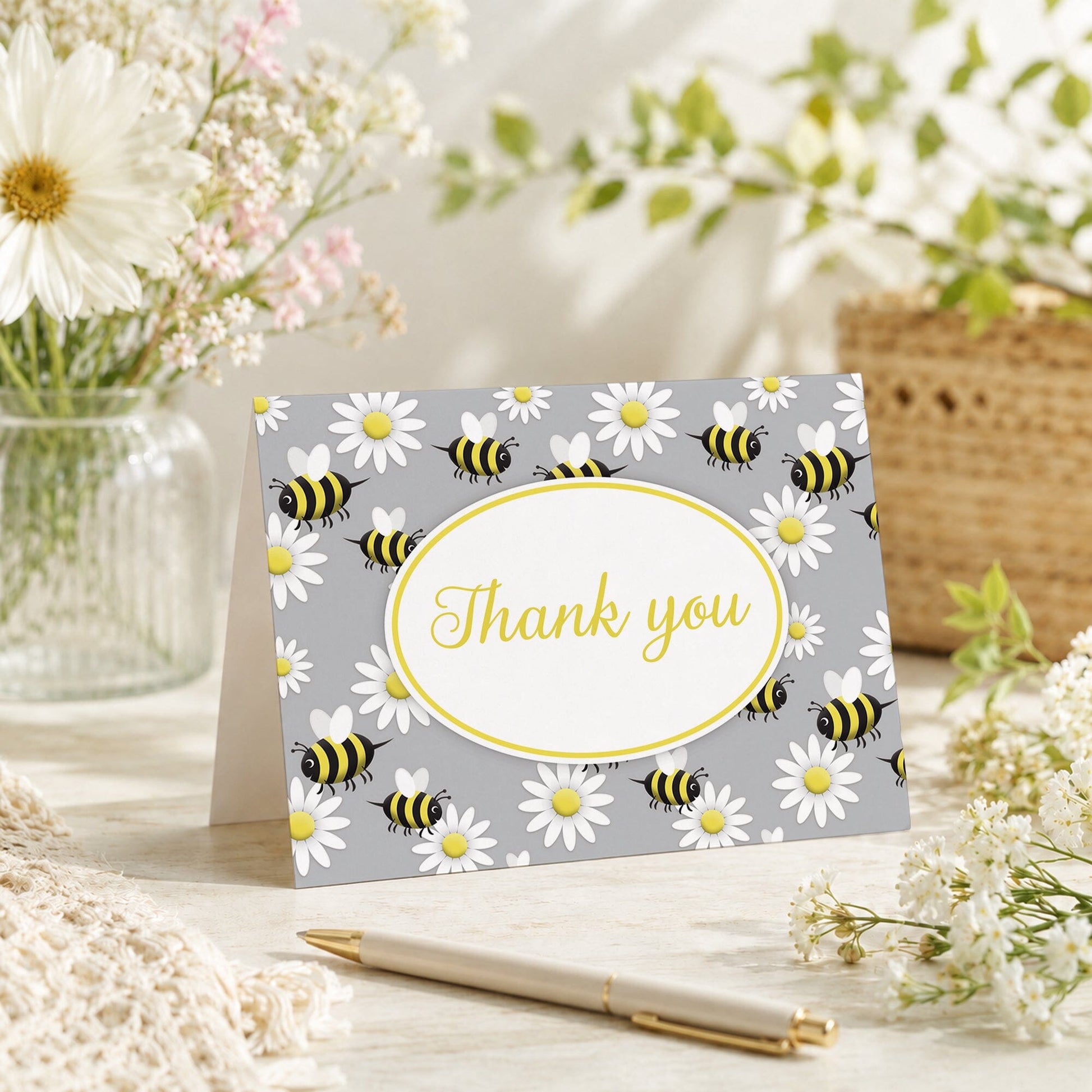 Happy Bee and Daisy Pattern Thank You Card shown on a tabletop with a vase, spring and summer flowers, and a pen.