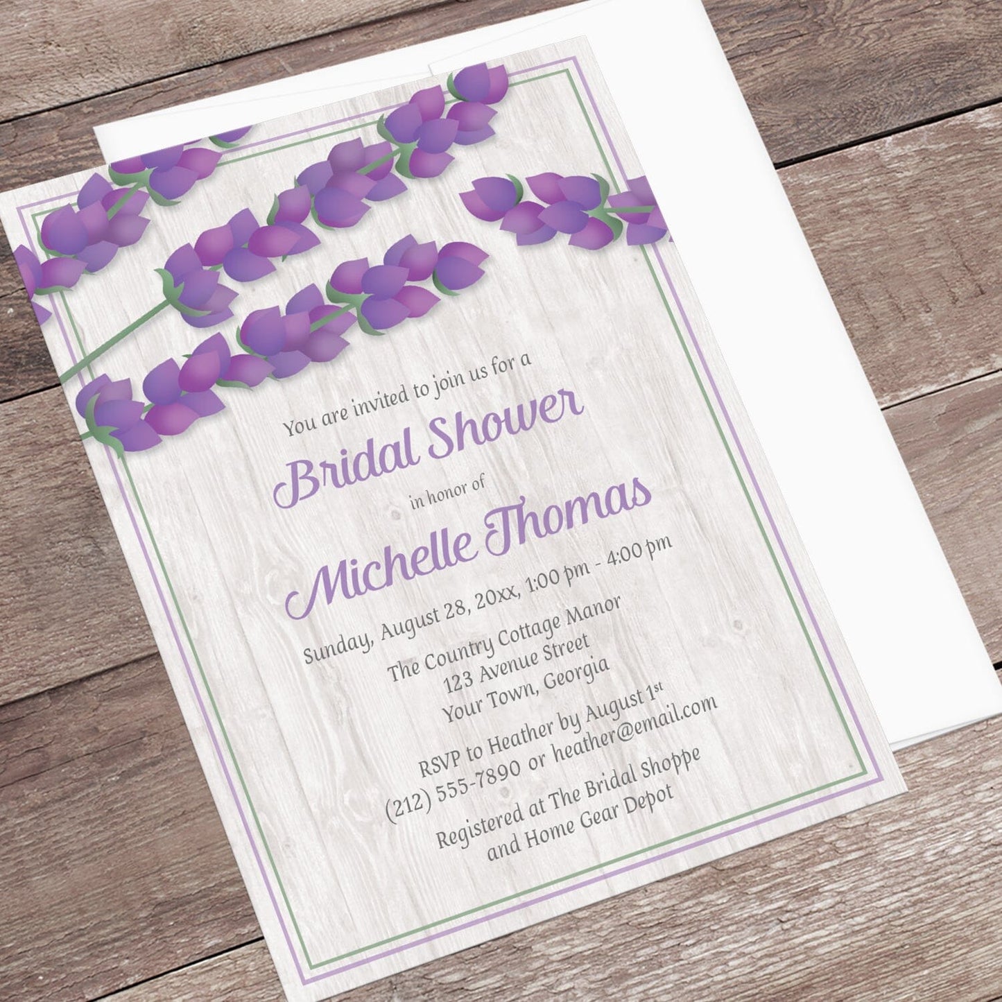 Whitewashed Wood Lavender Bridal Shower Invitation shown at an angle on a rustic wood surface with a white envelope.