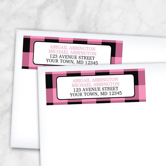 2 Light Pink and Black Buffalo Plaid Address Labels shown on white envelopes on a marble surface
