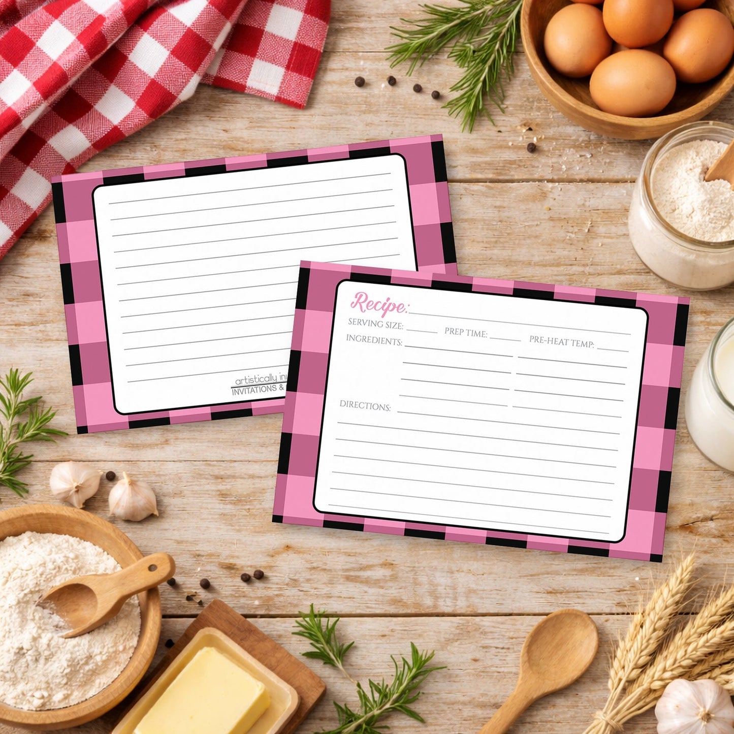 Two Light Pink and Black Buffalo Plaid Recipe Cards with pink checkered borders on a rustic wooden surface with country cooking ingredients.