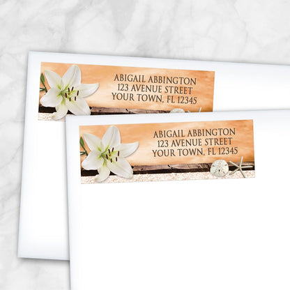 2 Lily Seashells and Sand Autumn Beach Address Labels shown on white envelopes on a marble surface