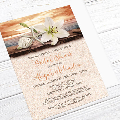 Bridal Shower invitation with an autumn beach theme, laid on a light wood tabletop