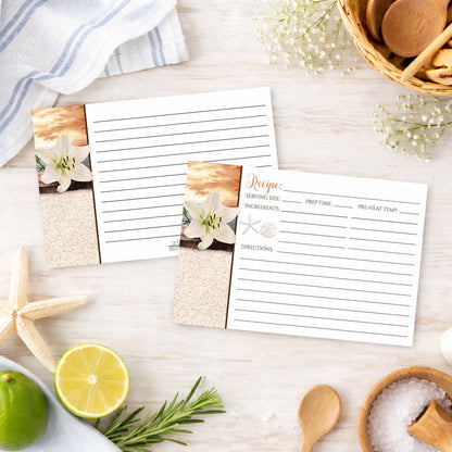 Set of Lily Seashells and Sand Autumn Beach Recipe Cards on a beach house countertop with kitchen items and ingredients.