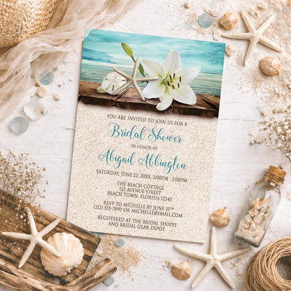 Lily Seashells and Sand Beach Bridal Shower Invitation on a sandy background.