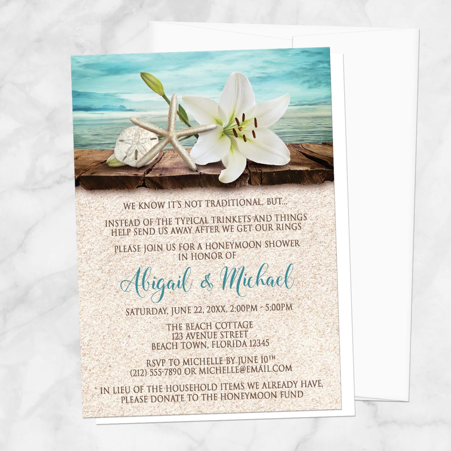 Lily Seashells and Sand Beach Honeymoon Shower Invitation shown on a marble surface with a white envelope.