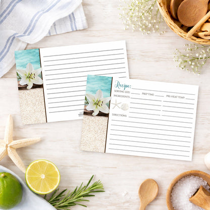 Set of Lily Seashells and Sand Beach Recipe Cards on a wooden surface with summer beach house kitchen items.