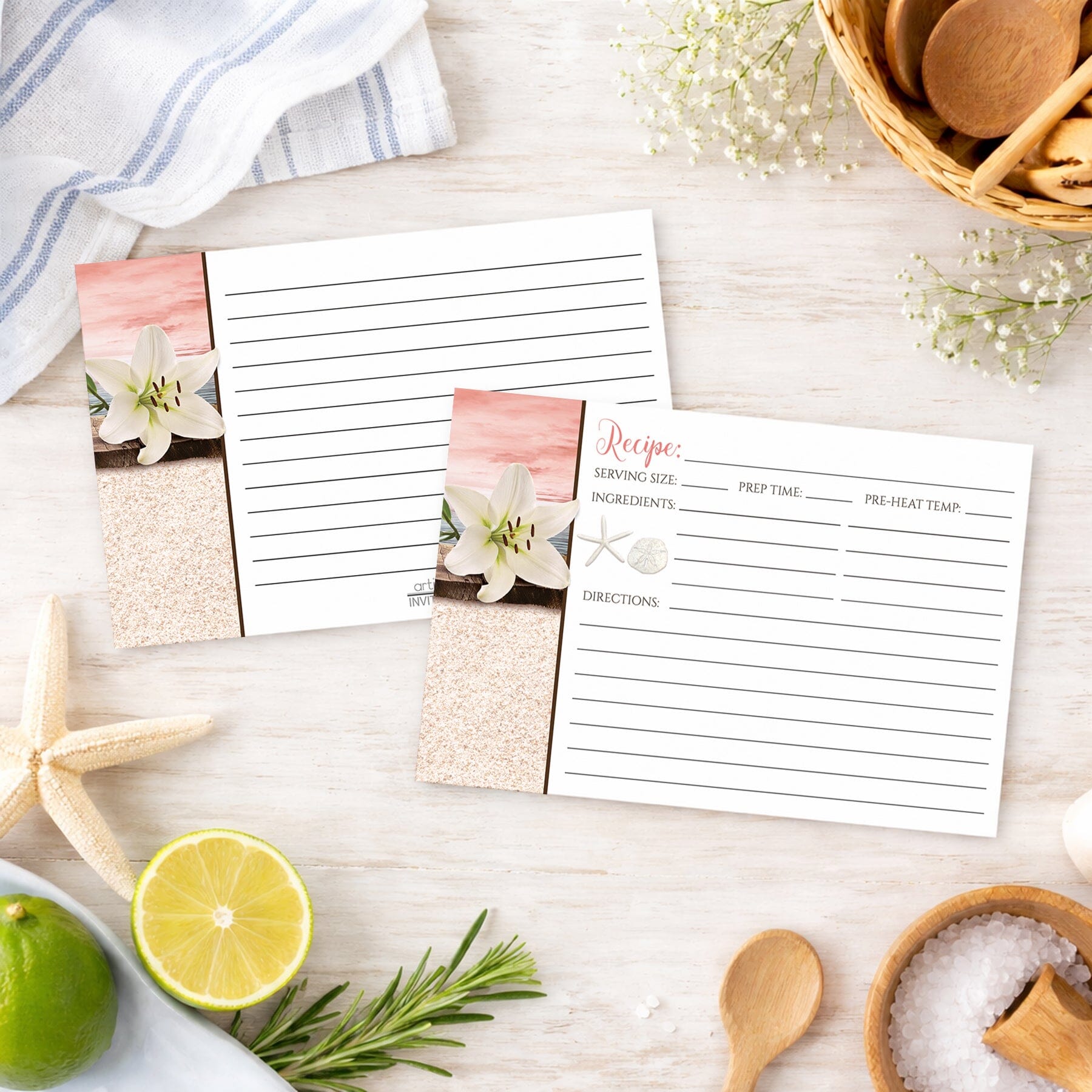 Set of Lily Seashells and Sand Coral Beach Recipe Cards on a beach house kitchen counter with ingredients and utensils.