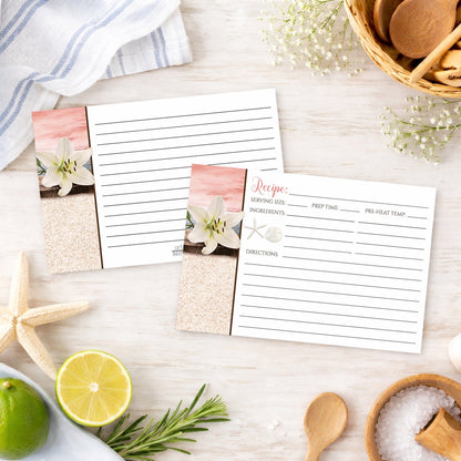 Set of Lily Seashells and Sand Coral Beach Recipe Cards on a beach house kitchen counter with ingredients and utensils.