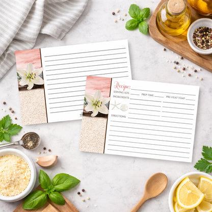 Set of Lily Seashells and Sand Coral Beach Recipe Cards on a kitchen counter with ingredients.