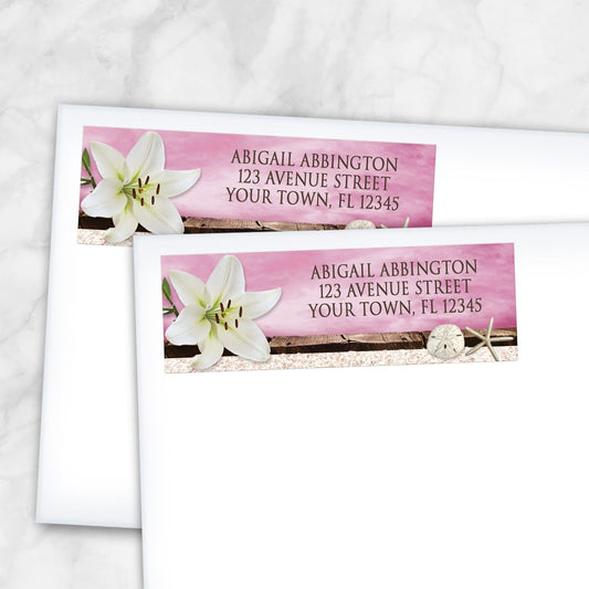 2 Lily Seashells and Sand Magenta Beach Address Labels shown on white envelopes on a marble surface