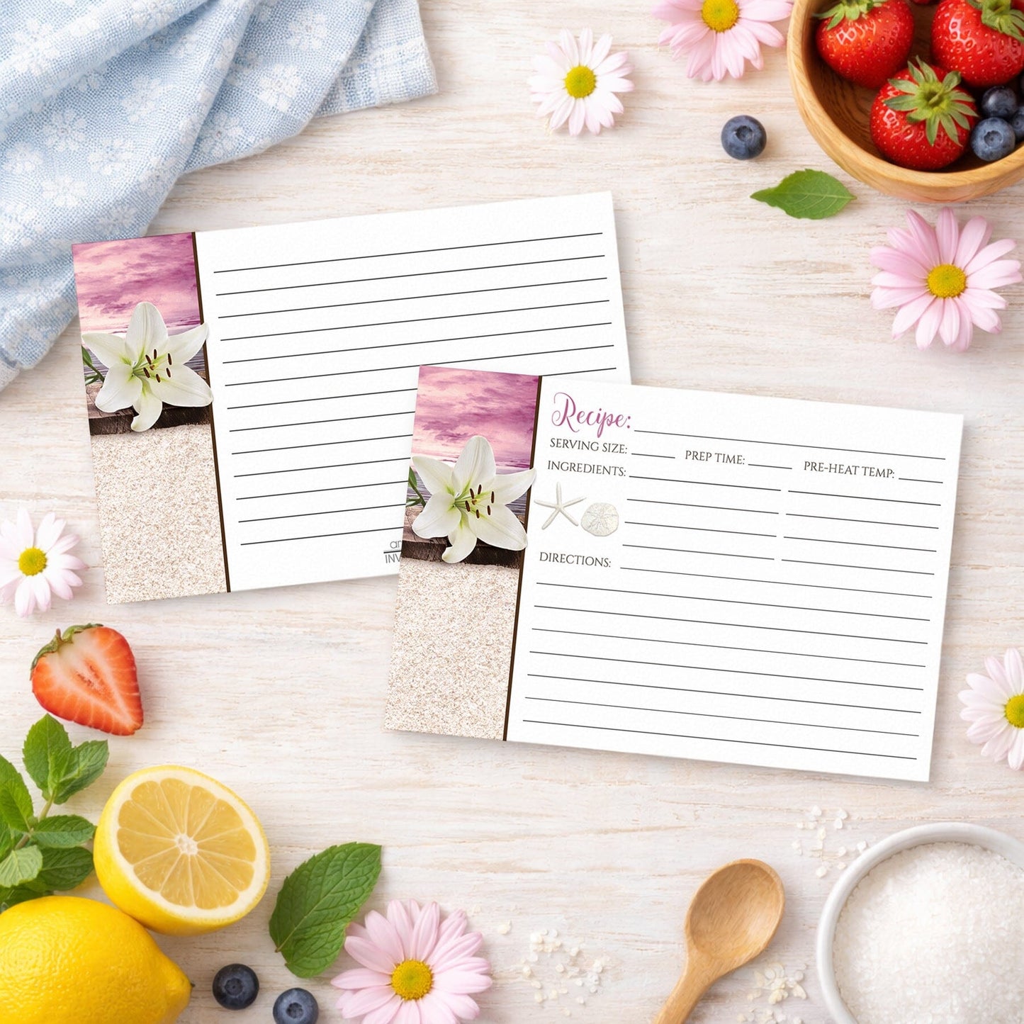 Set of Lily Seashells and Sand Magenta Beach Recipe Cards on a wooden surface with spring and summer fruits and flowers
