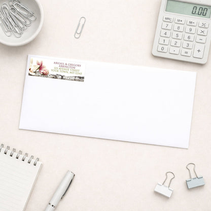 Magnolia Birch Light Floral Address Label shown on a white envelope with everyday office supplies