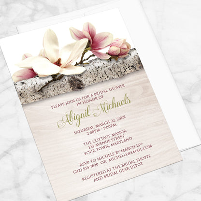 Bridal Shower invitation with a light magnolia design, on a marble tabletop