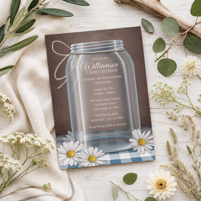 Mason Jar Daisy Blue Gingham Family Reunion Invitation shown on a light wooden surface with spring and summer plants.