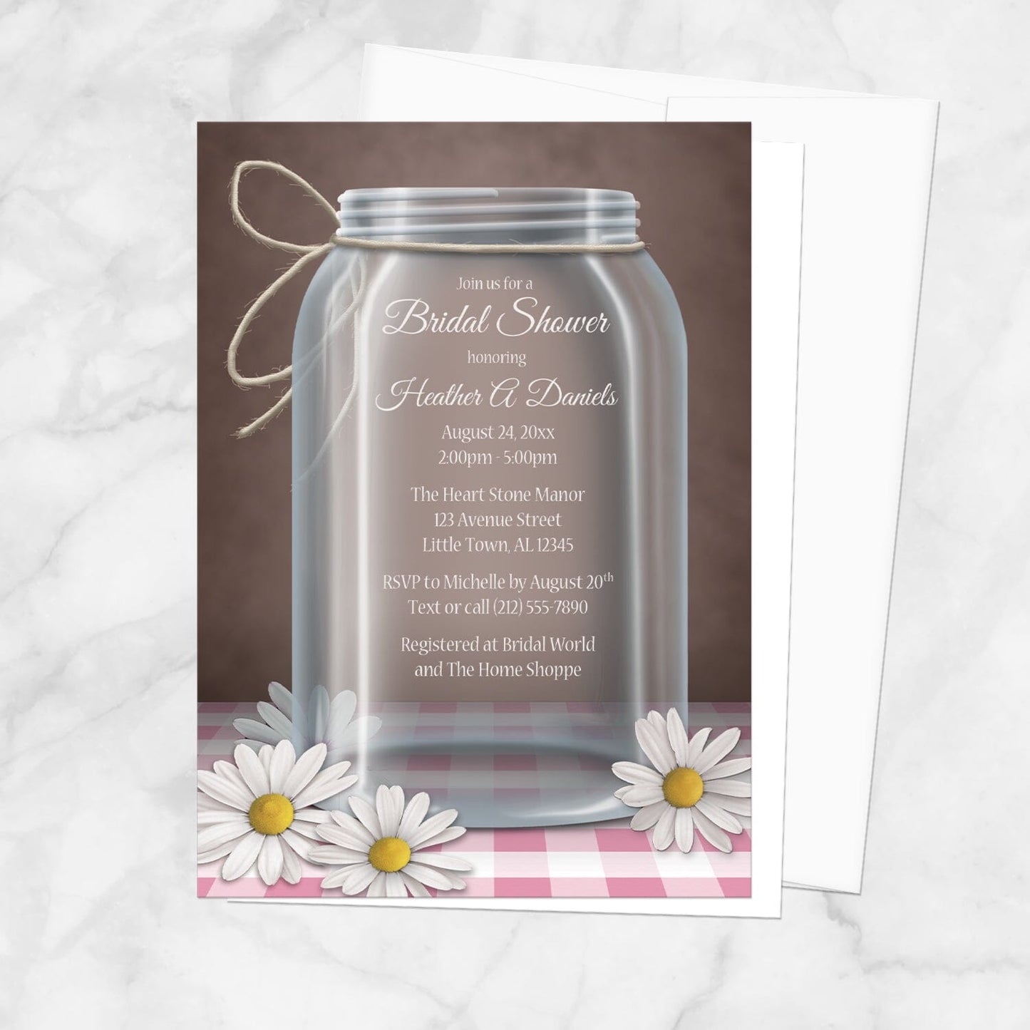 Bridal Shower invitation with a mason jar design with white daisies and pink gingham over a rustic brown background, displayed with a white envelope over a marble surface