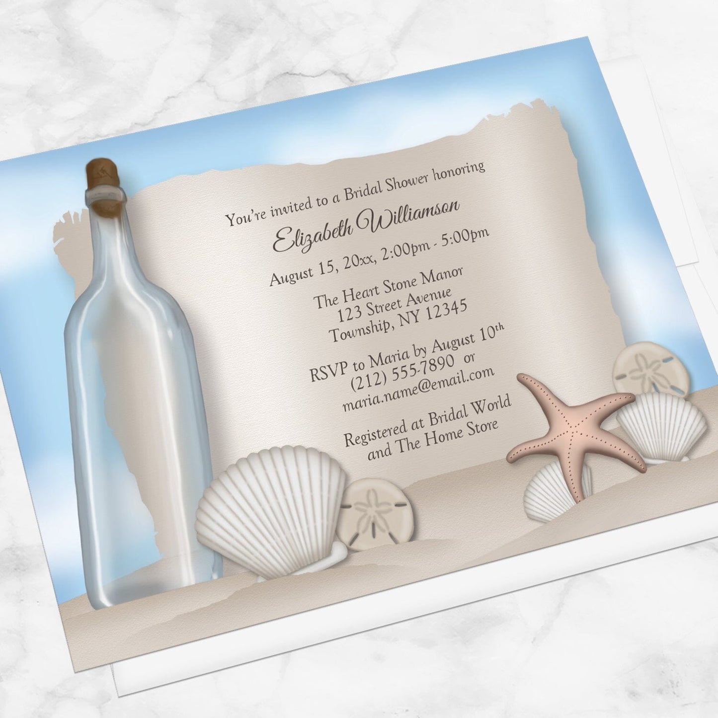 Message from a Bottle Beach Bridal Shower Invitation shown at an angle on a marble surface