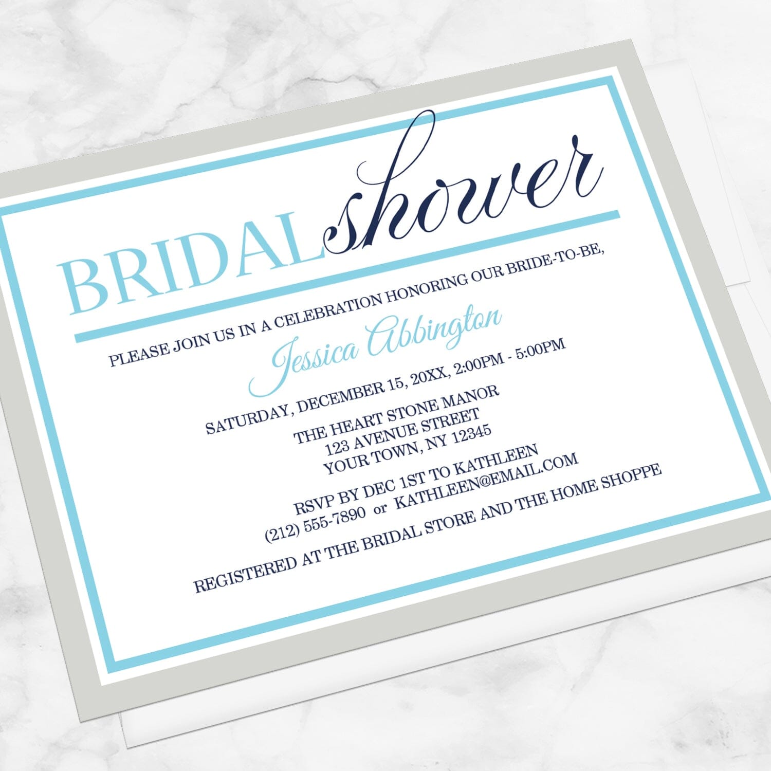 Modern Aqua Navy Gray Winter Bridal Shower Invitation shown at an angle on a marble surface with a white envelope.
