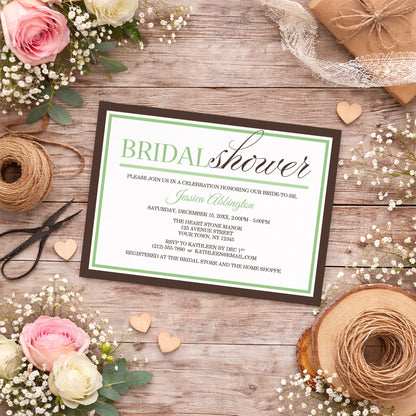 Modern Green and Brown Bridal Shower Invitation shown on a country-style wooden surface with spring and summer flowers, small wood hearts, and twine.