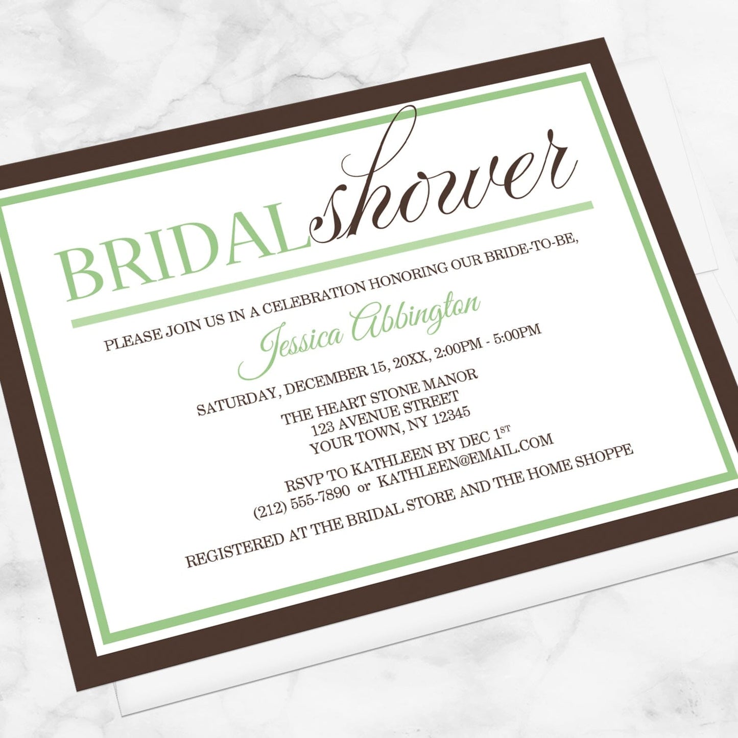 Modern Green and Brown Bridal Shower Invitation shown at an angle on a marble surface with a white envelope.