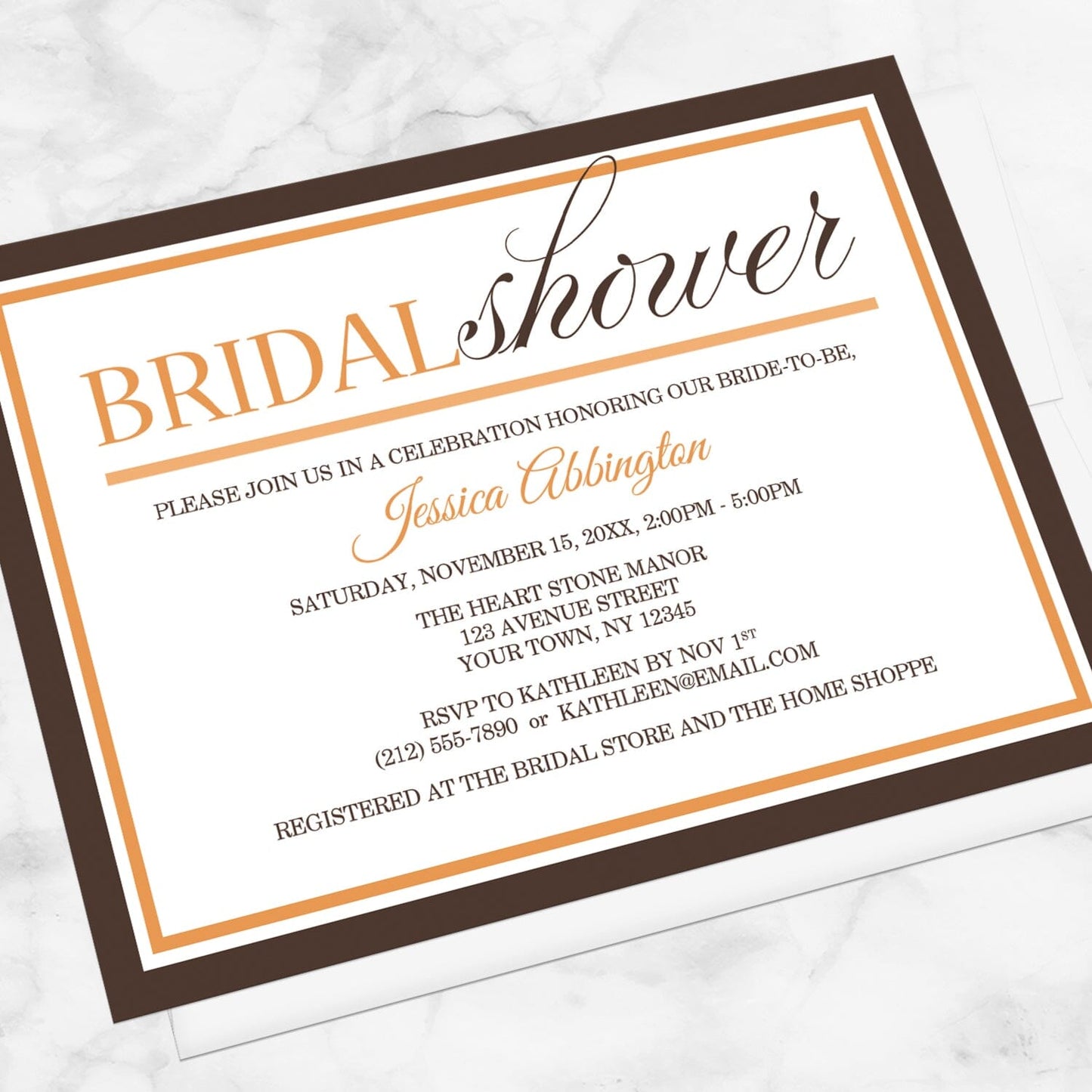 Modern Orange and Brown Autumn Bridal Shower Invitation shown at an angle on a marble surface with a white envelope.